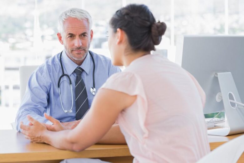 A woman talks to her doctor about the best time of the month to get pregnant.