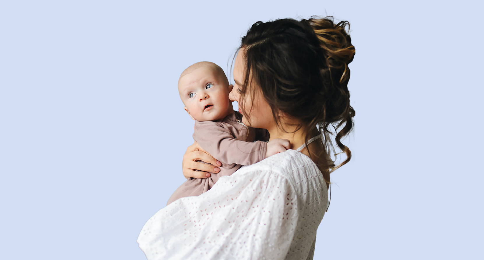 A mother holds her baby after spending time as a patient at the Irving, Texas location of IVFMD