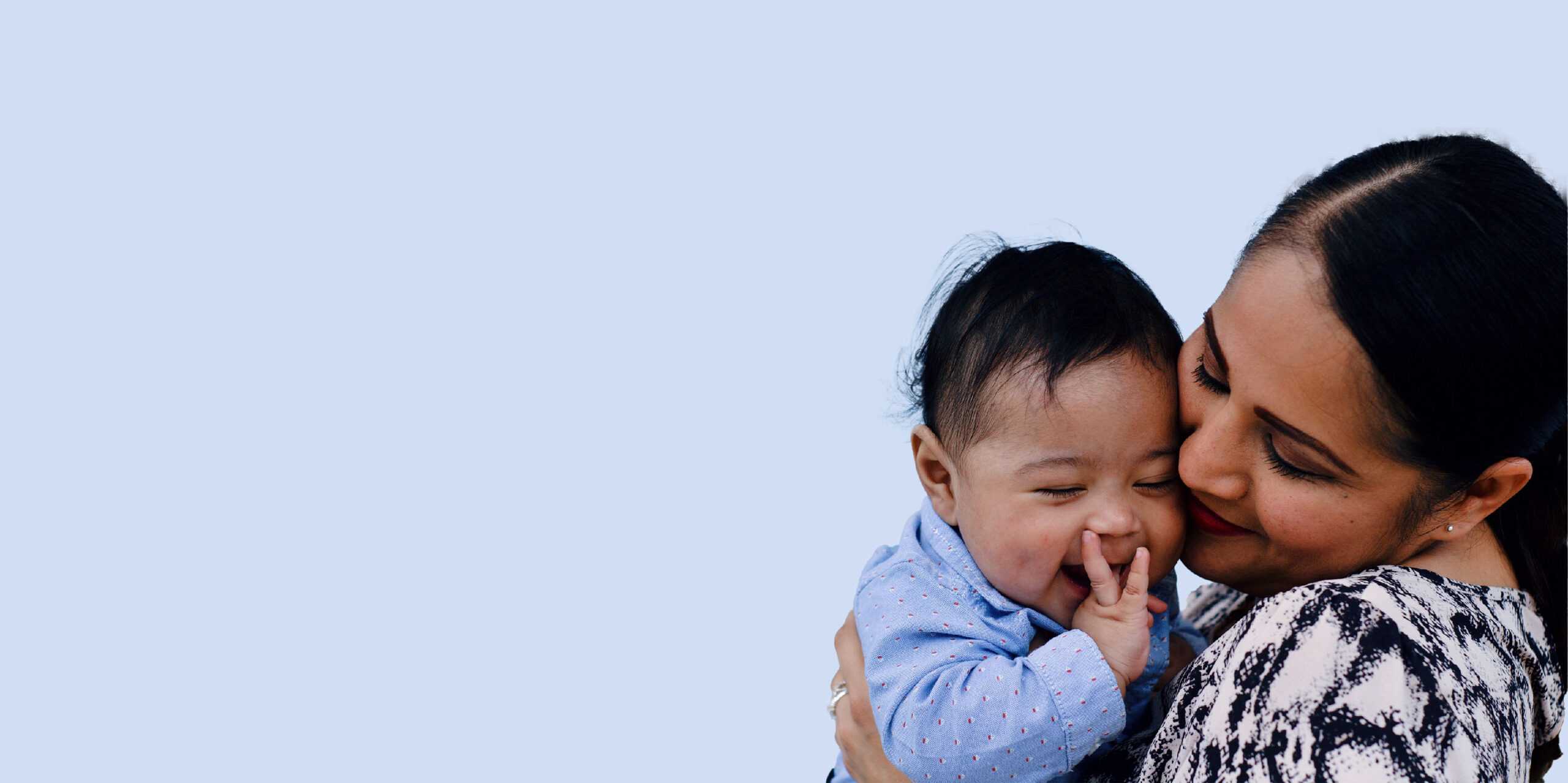 A woman holds her adorable baby – this woman was able to conceive thanks to the services provided at IVFMD in Texas